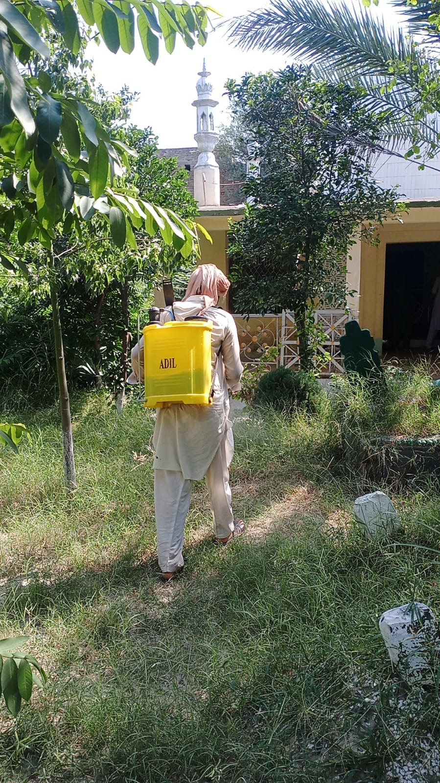 Tending a QIF-supported community plot.